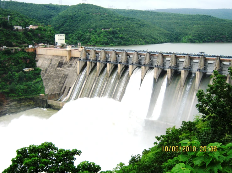 water coming down the side of a big dam