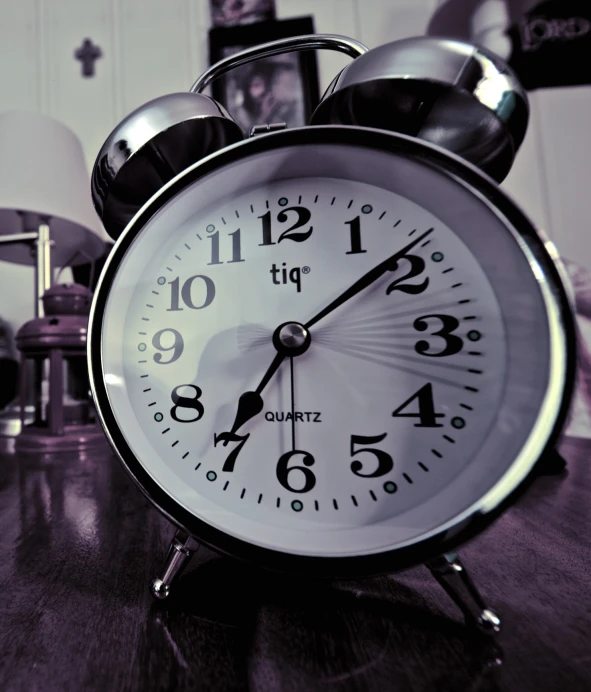 an alarm clock is shown on the table
