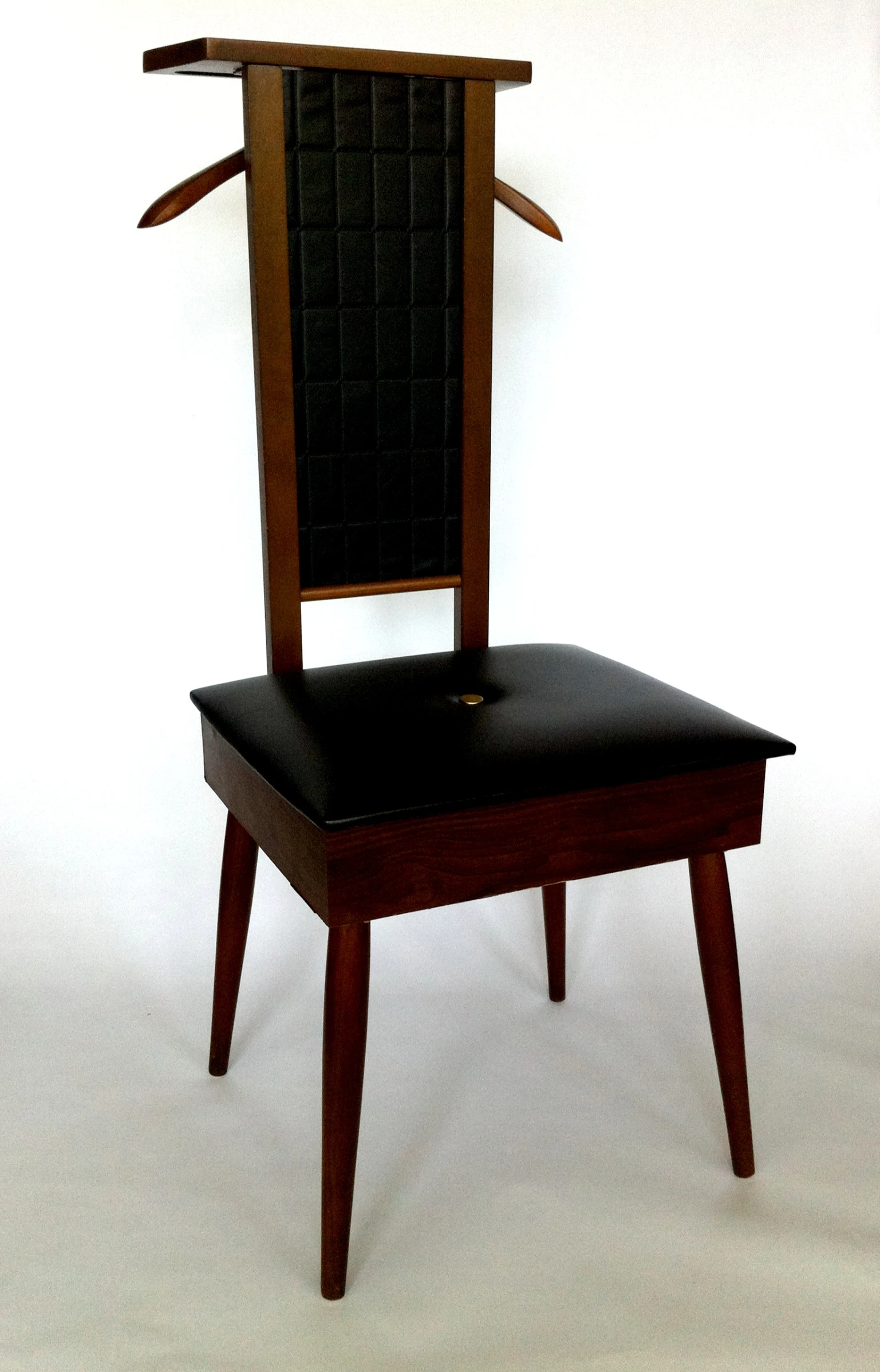 a wooden chair with black seat cushion and a wooden back