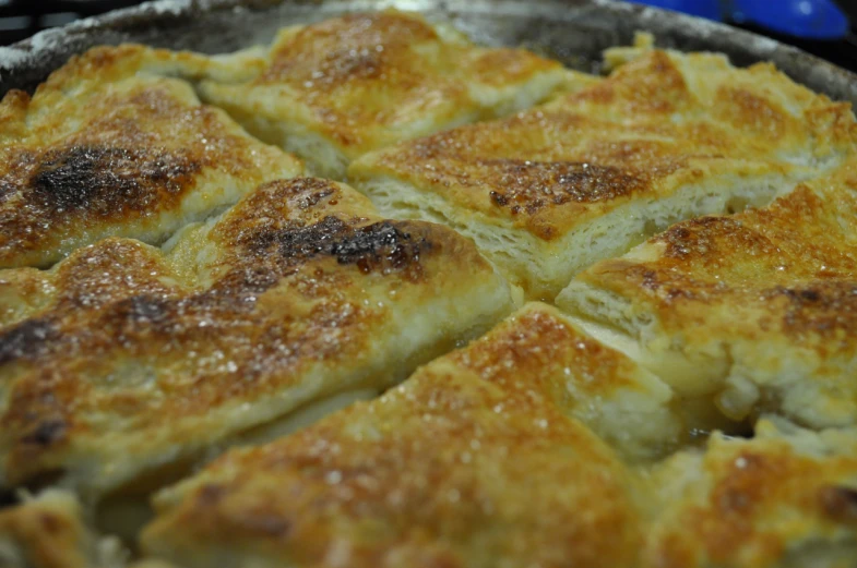 there is a metal pie pan with a pie crust on it