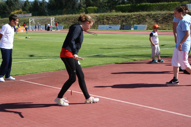 two women walking on a tennis court with s