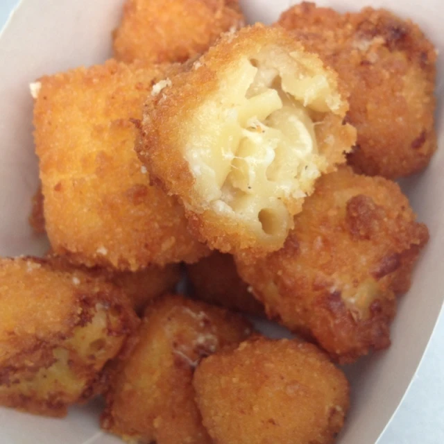 a pile of fried fried food on a white plate