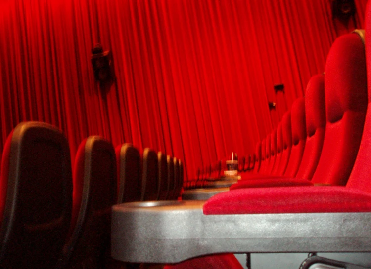 seats at a movie theater are lined up on the counter