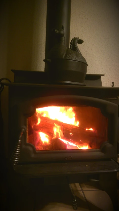 a stove with flames is shown in the dark
