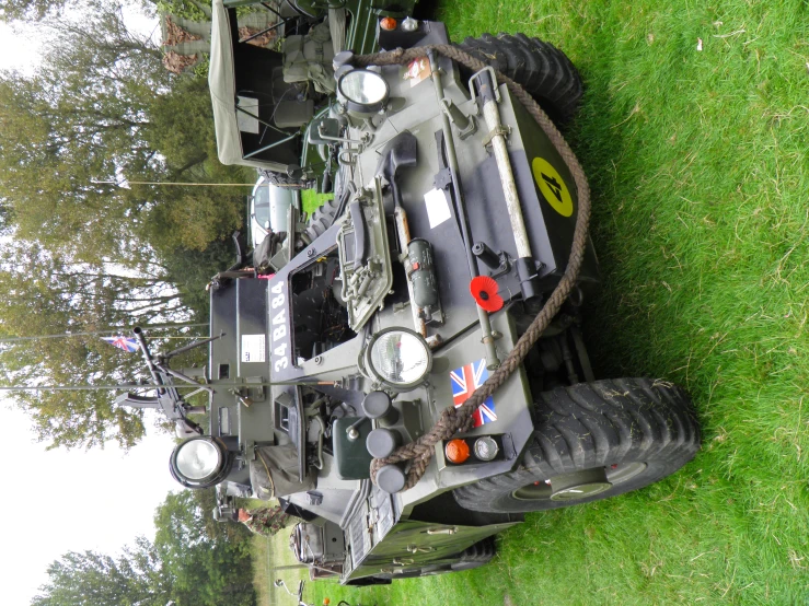 military vehicle lying on grass in a park