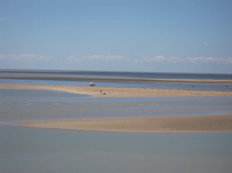 there are two boats that are on the beach