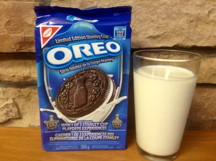 chocolate cookie next to a glass of milk