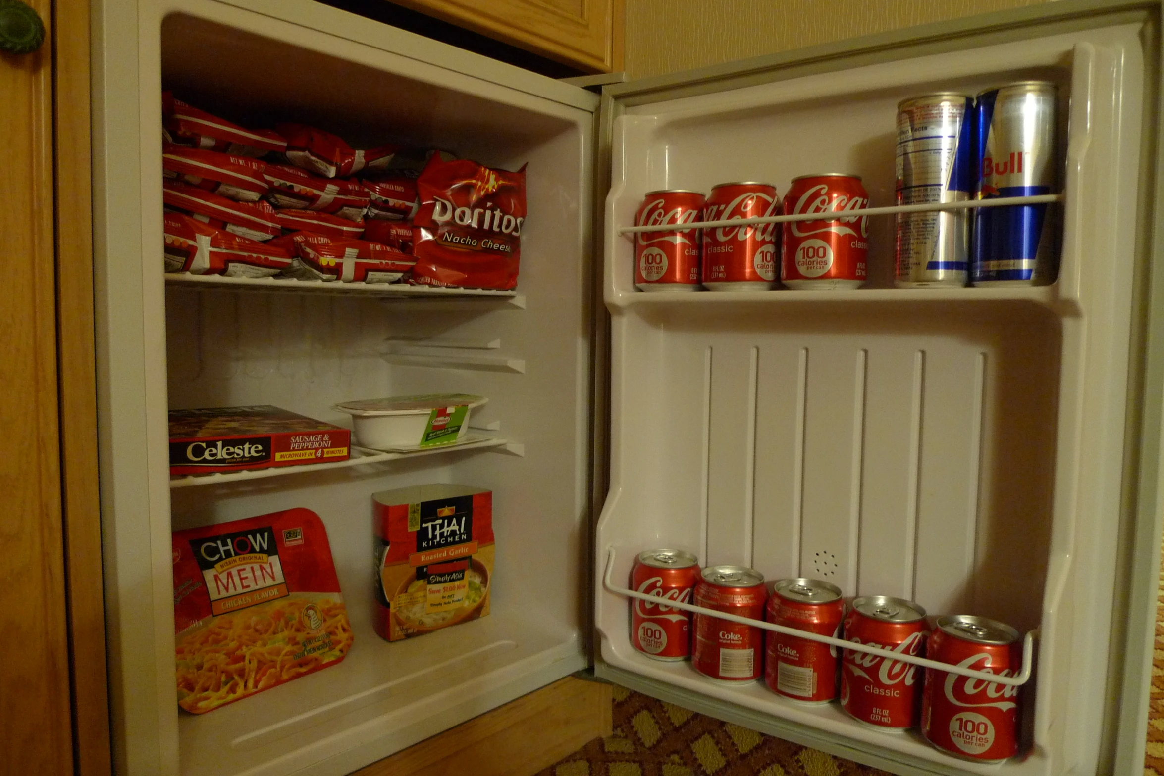 an open refrigerator filled with food and drinks