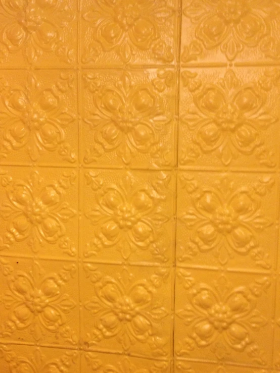 a wall covered in a tile pattern with only two different colors