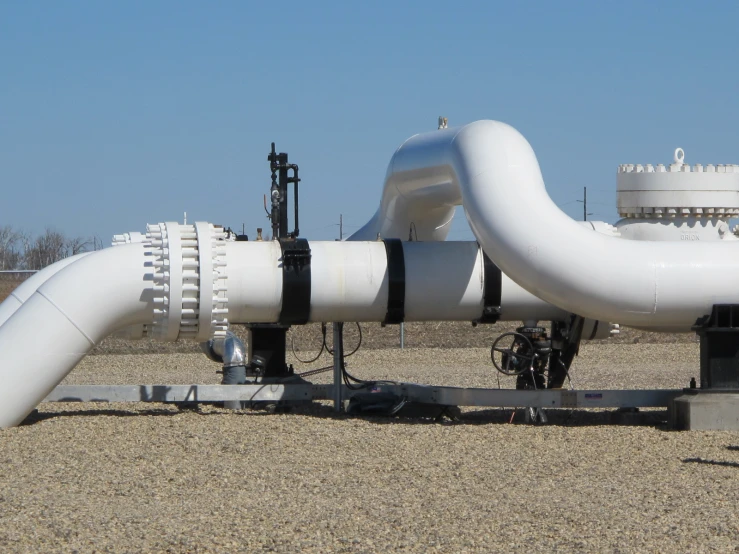 an industrial gas pipeline with white pipes and valves