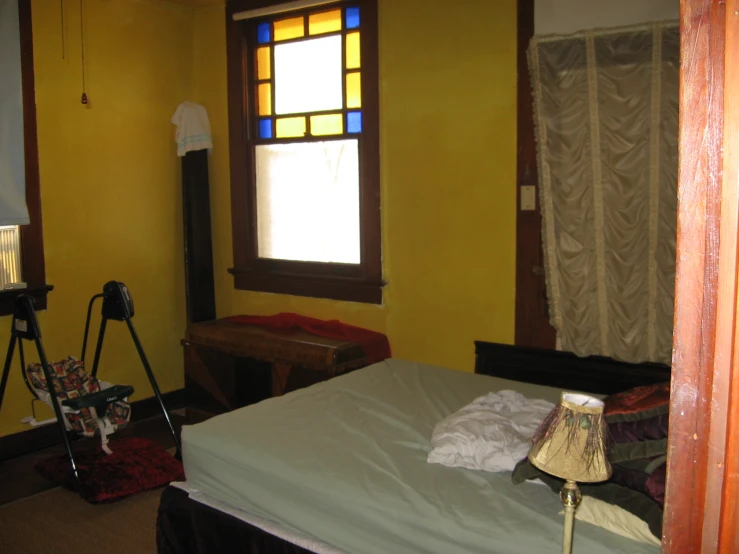 bedroom with large window and bright light from the window