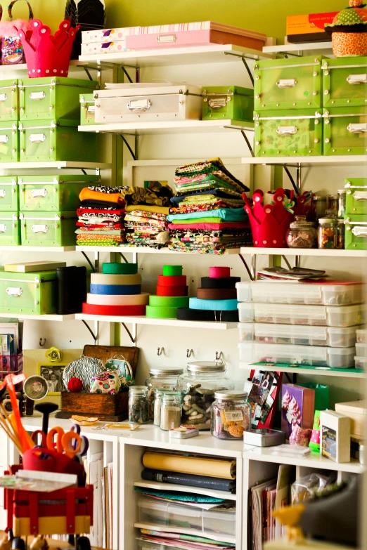 a storage area with green bins and shelves