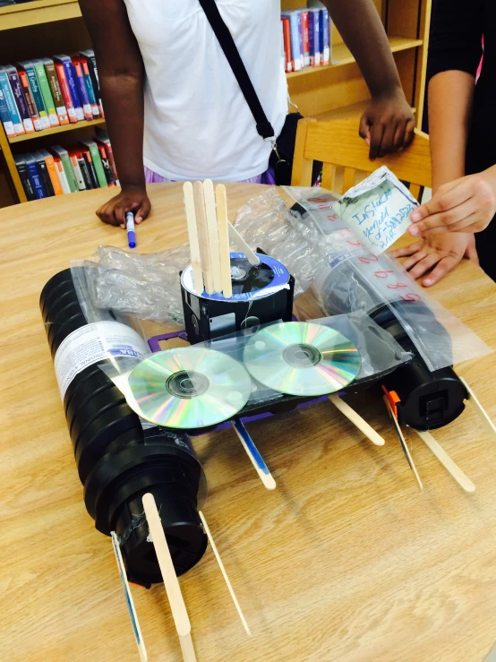 the small electronic device is powered on a wooden table