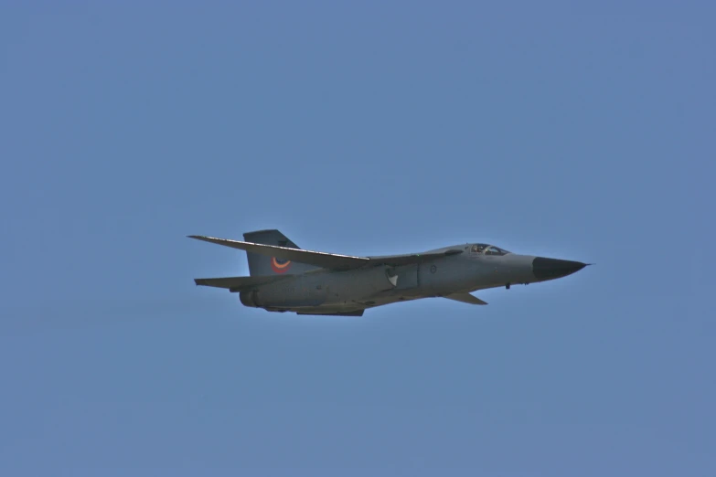 an air plane in a blue sky flying