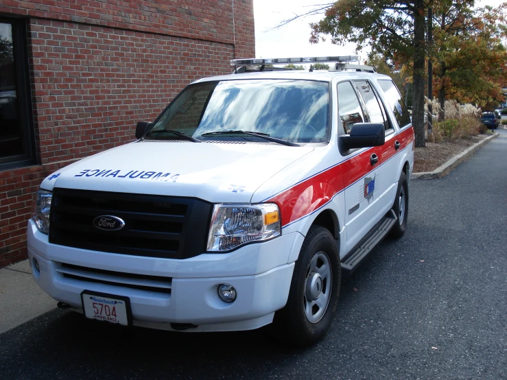 a truck that is parked next to a brick building