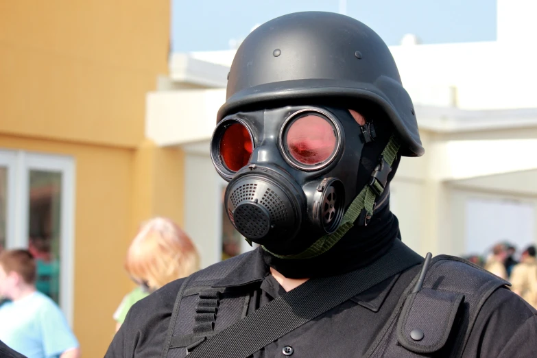 a person wearing a gas mask and protective gear