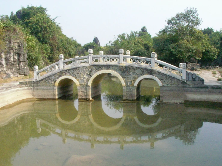 the small bridge is designed to look like it could have a small arch