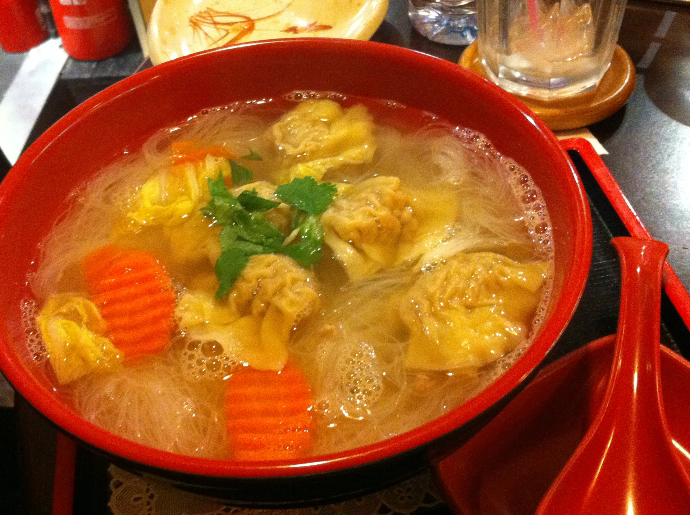 a bowl that has meat and vegetables inside of it