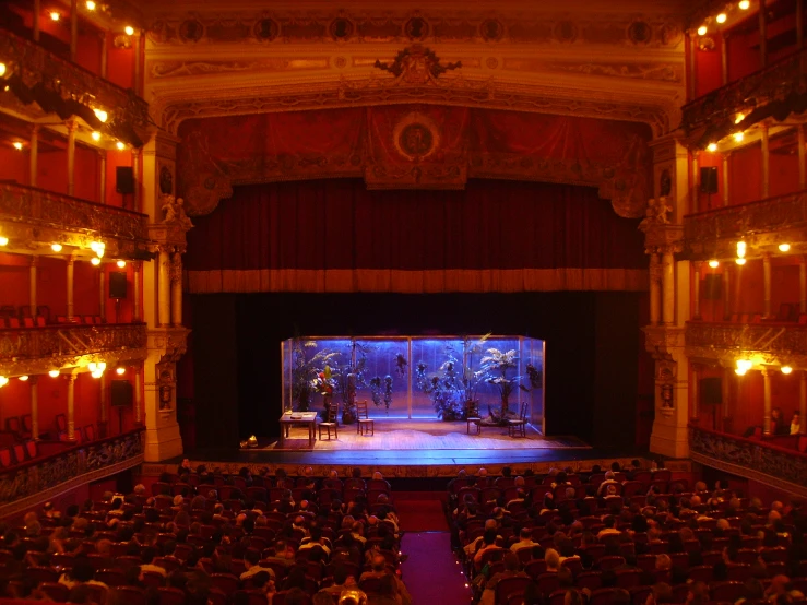 a stage set with an empty audience in the center