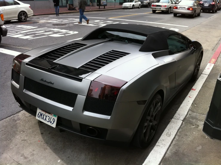 silver sports car on the side of the road