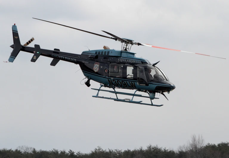 two helicopter with people in it fly through the sky