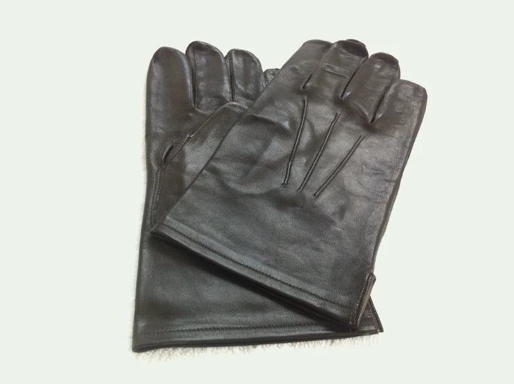 the leather gloves on top of each other