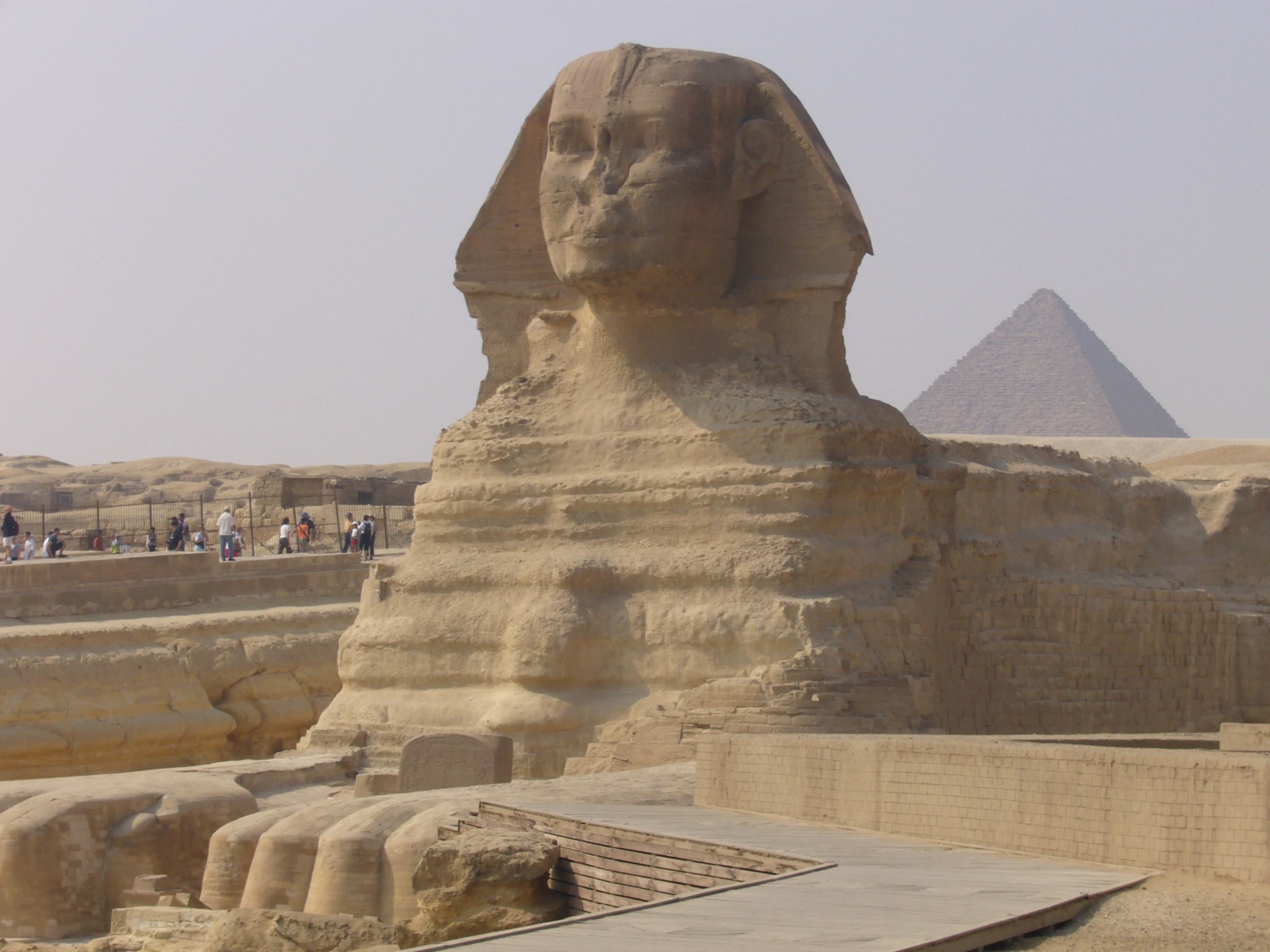 a large sphinx and a very long pyramid