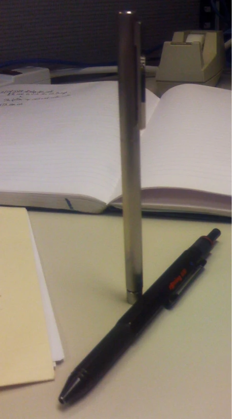 a pen sitting on top of a paper