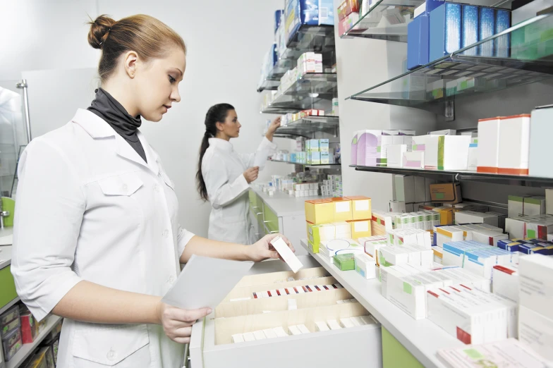 the two women are in a pharmacy shop