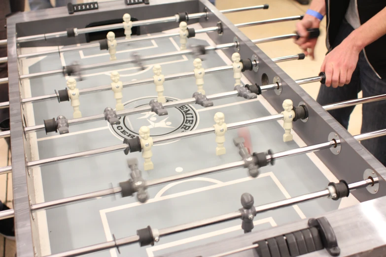 foosball board in process on table top at indoor event