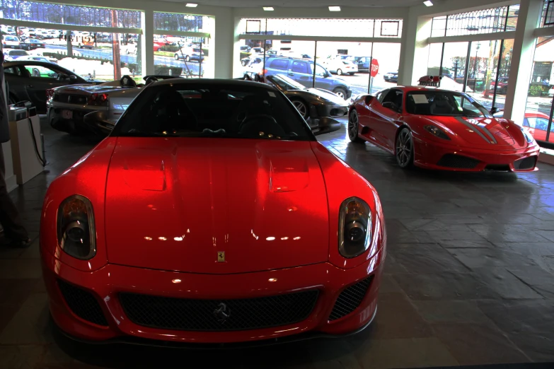 ferrari cars are shown in a large dealership