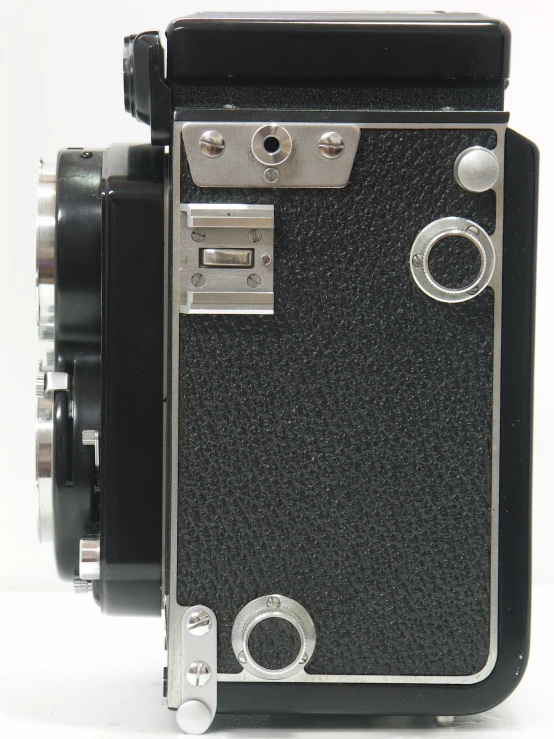 an old camera with its light and lens