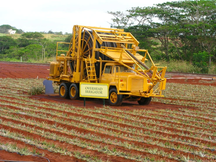 a truck with a crane is on the field