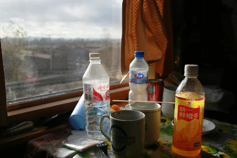 several items sitting on the table, near a window