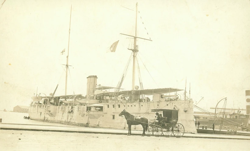 a horse drawn carriage is parked on the dock