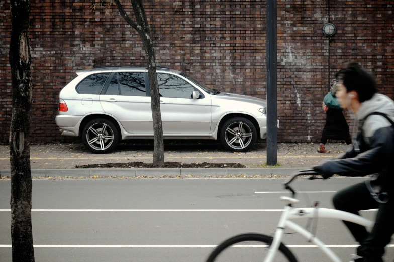 a person riding a bike on a city street