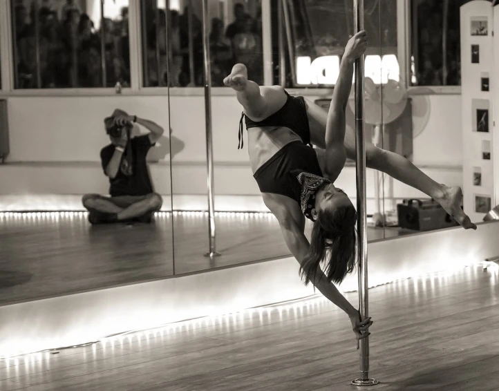 a girl doing acrobatic moves on the floor