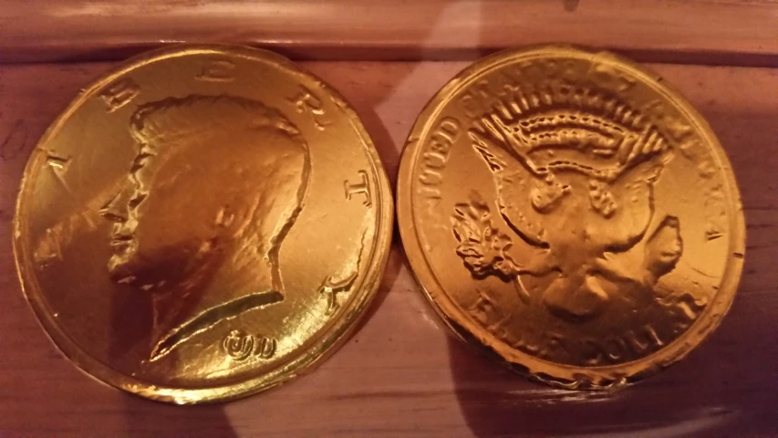 two golden coins, one that has been set next to each other