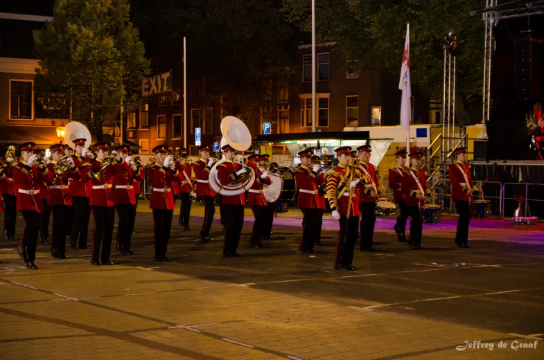 a band that is wearing red and gold clothes