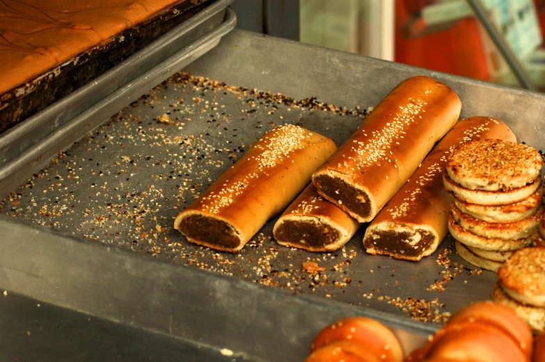 some sausage rolls that are on a baking sheet