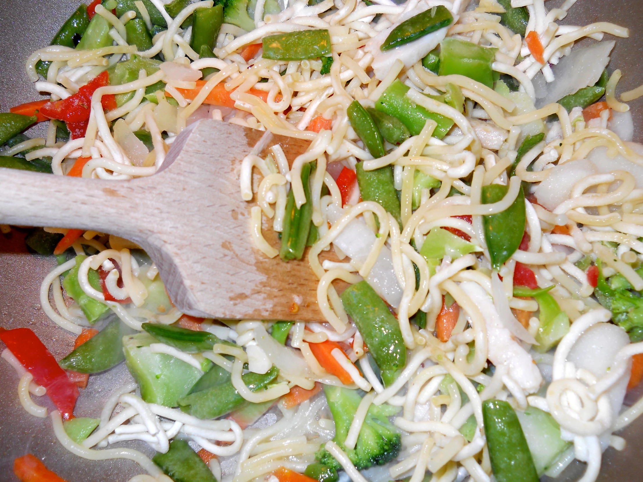 a frying pan has various vegetable stir fry in it