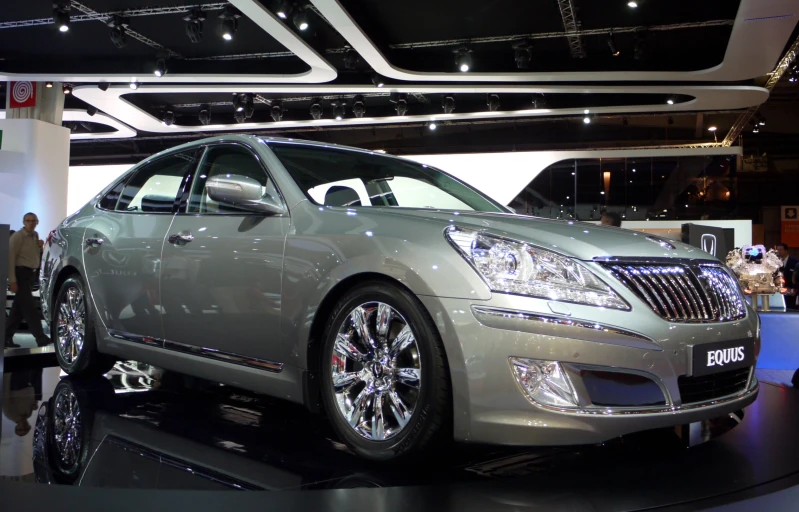 a picture of a silver and black car on display