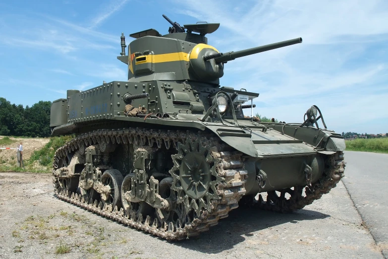 an old army tank on display in the grass