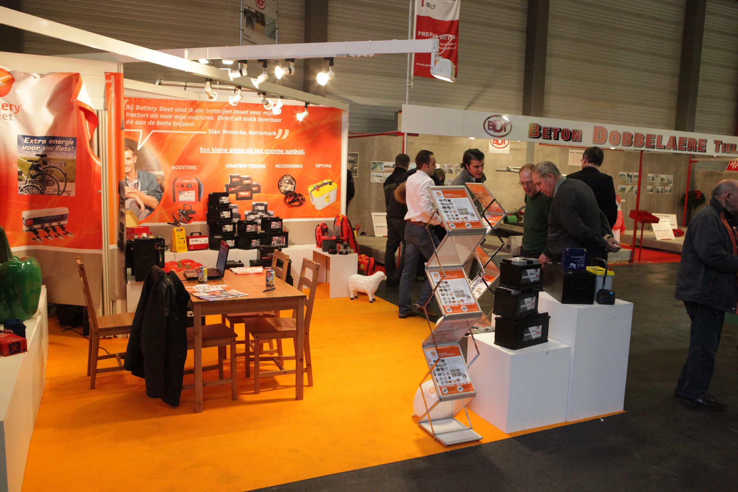 a group of people stand around a trade show