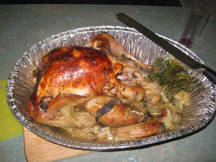 a turkey that is on top of some meat