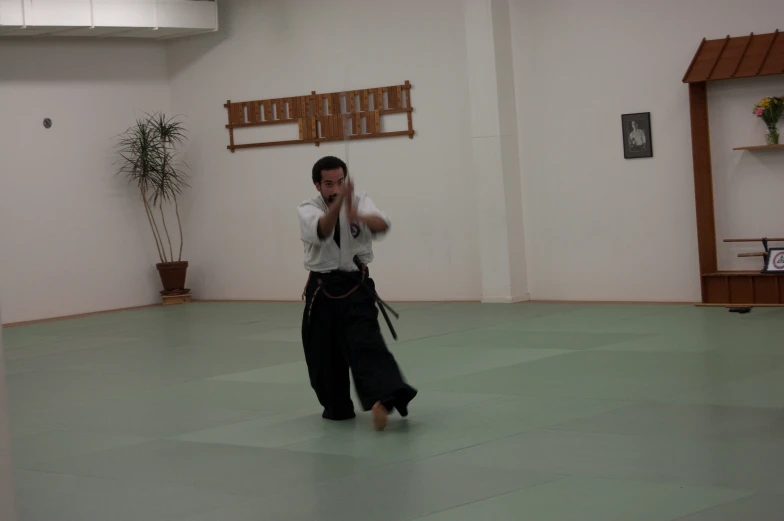 an image of a man on the floor doing a taito exercise