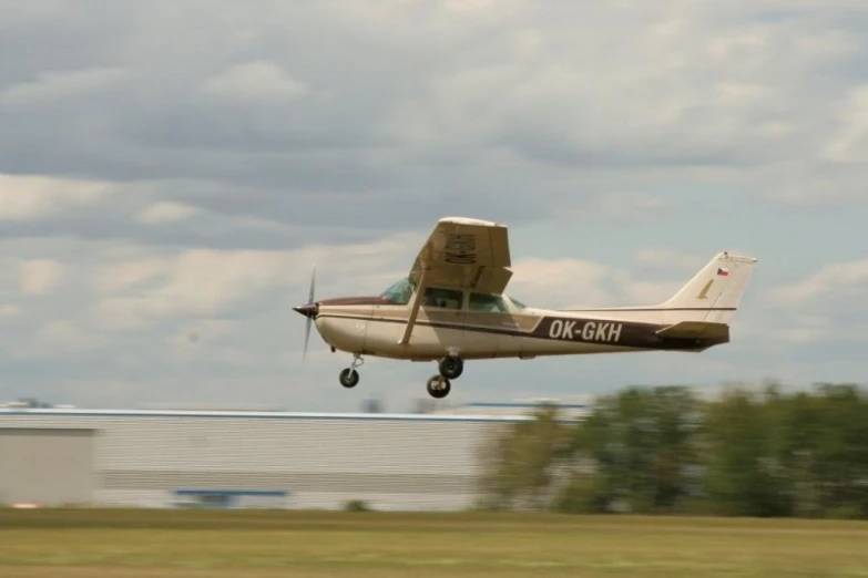 a small airplane is taking off in the sky