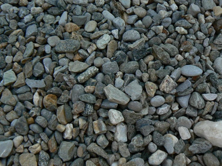 small rocks covered with sand and gravel