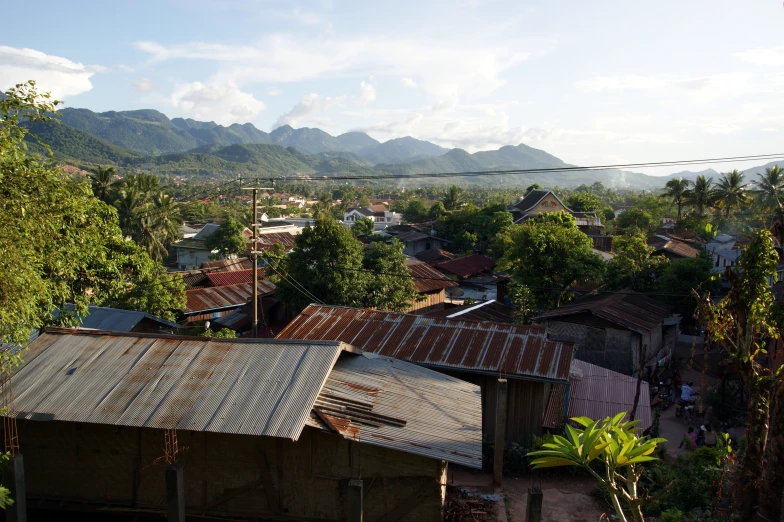 a village nestled between two mountains with trees