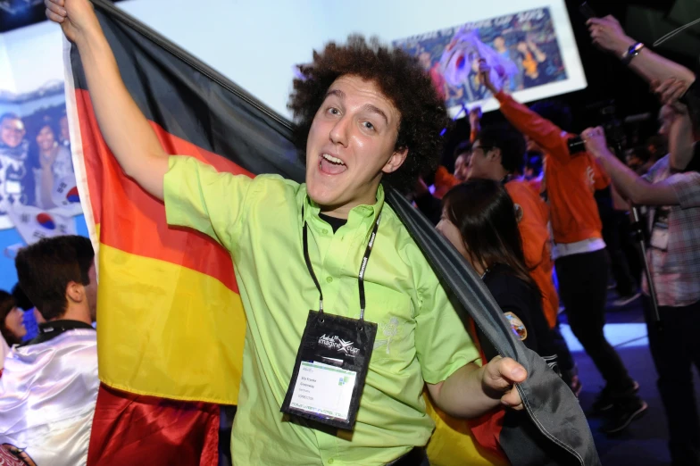 a man holding an australian flag and smiling